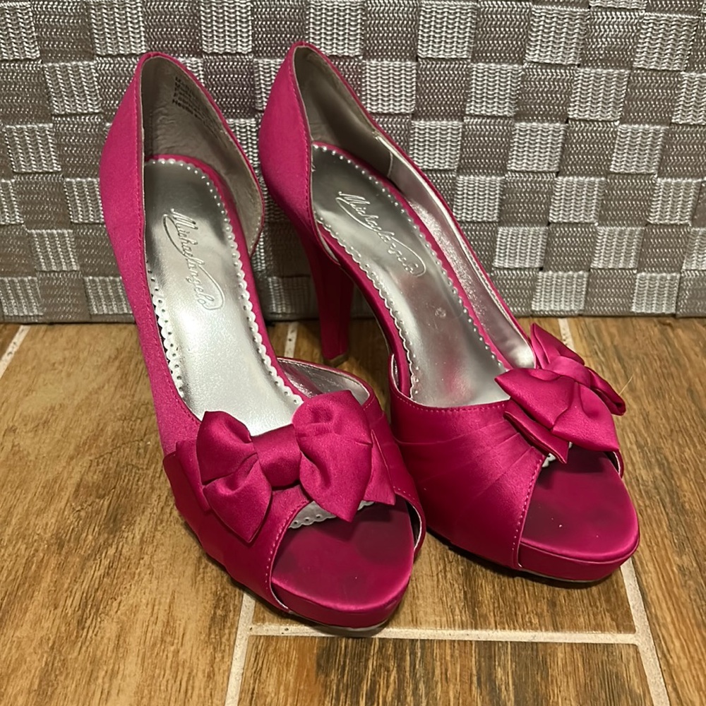 Pink/Magenta peep toe high heels, used but in good condition. By Michaelangelo.